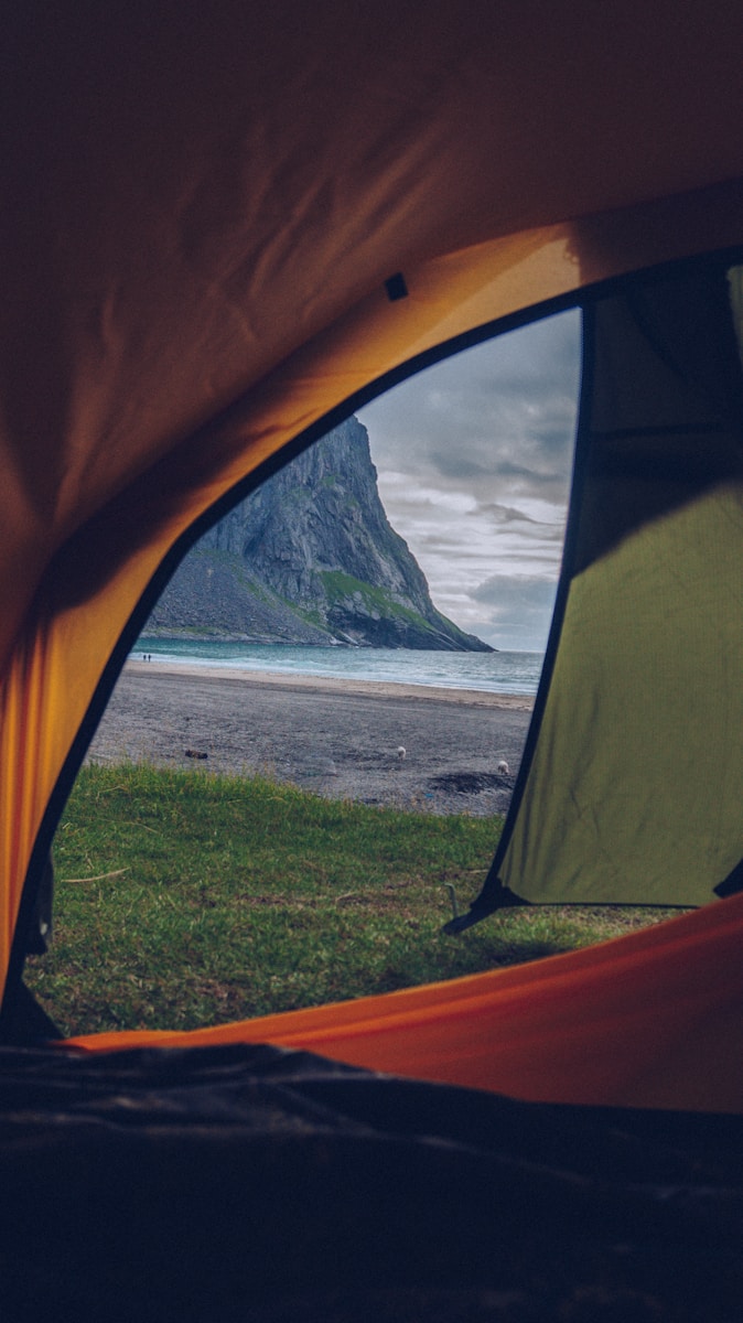 orange, green, and black tent